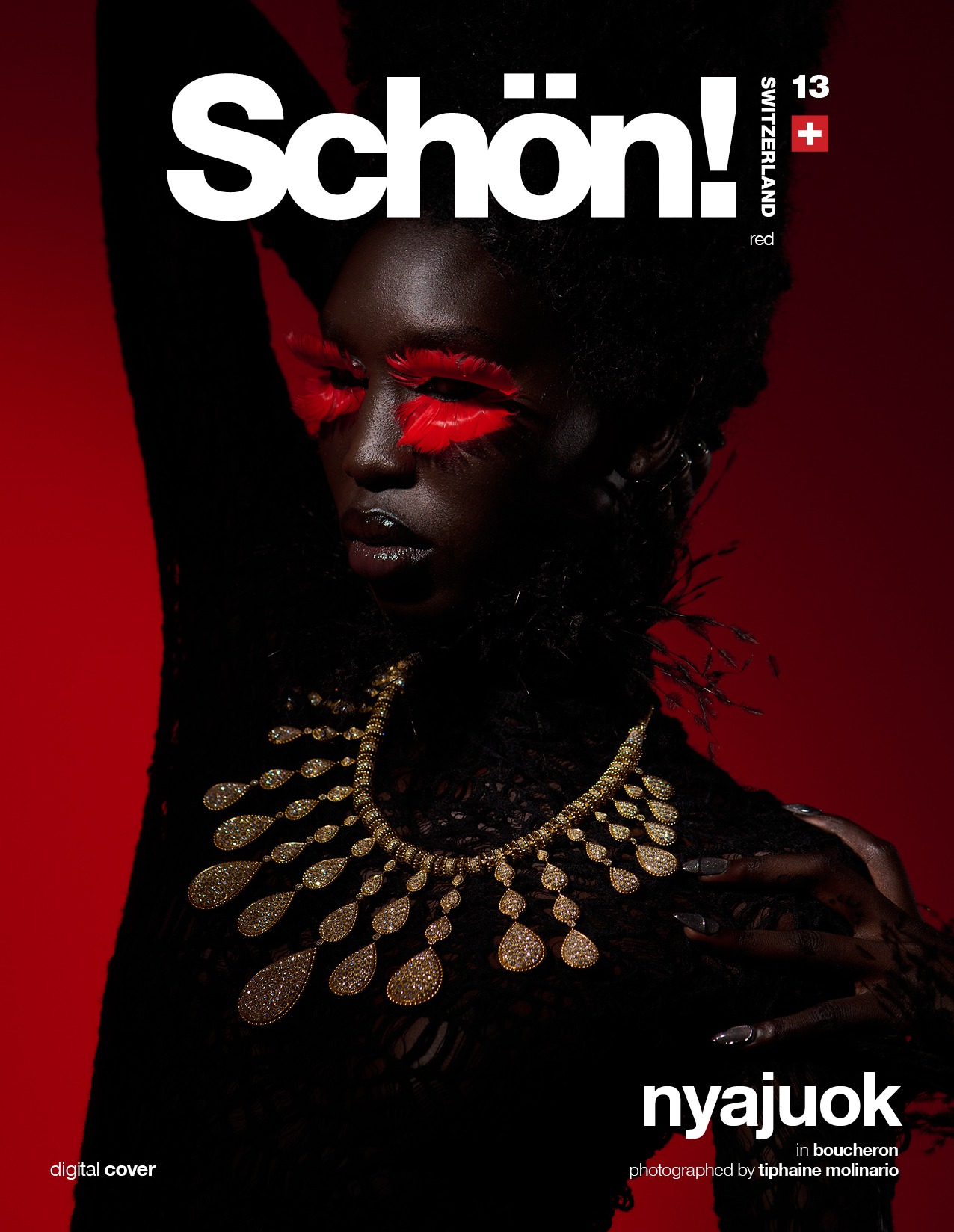 Cover for Schön Switzerland Issue 13 - red, young black woman with expansive necklace with a lot of tear shaped extensions
