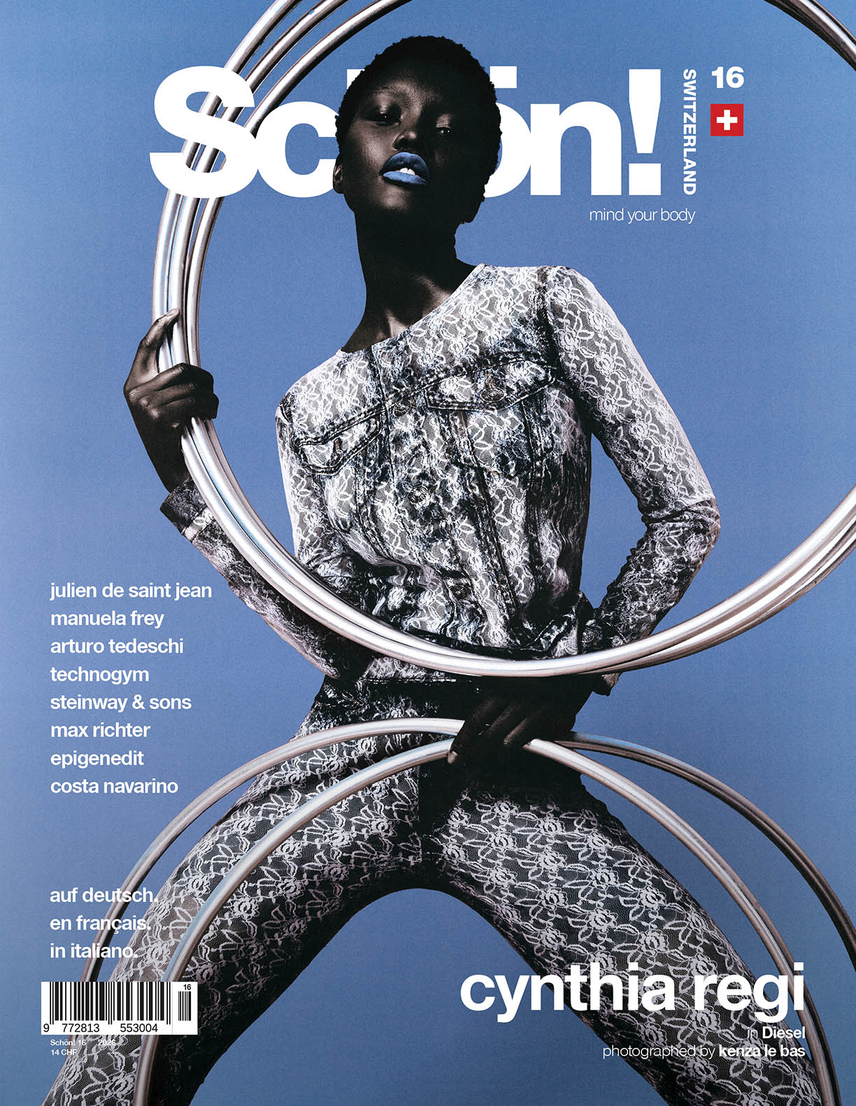 Cover of Schön! magazine, Switzerland issue 16, featuring full body shot of young black woman in a dark denim suite with white lace print holding several big silver metal rings in her hands on lightblue background