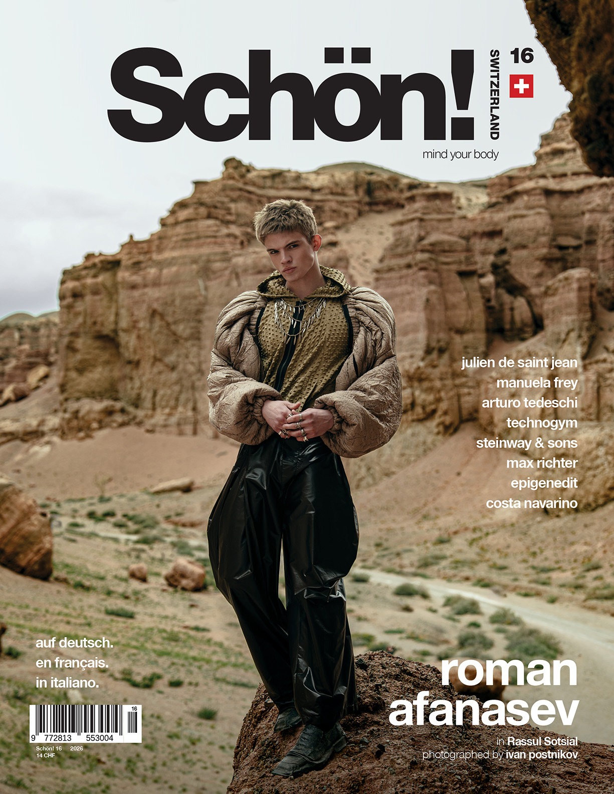 Cover of Schön! magazine, Switzerland issue 16, featuring young caucasian man in a beige longsleved top and black pants in a mountain landscape